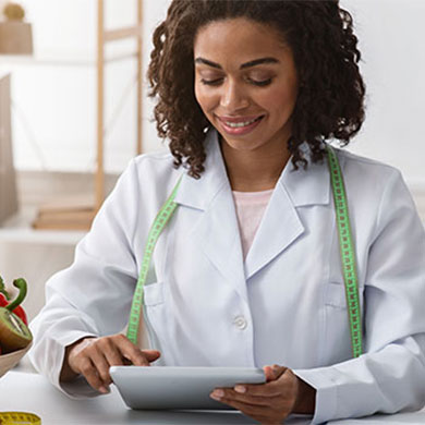 woman planning meals for client on tablet