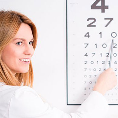 woman pointing at row on eye chart
