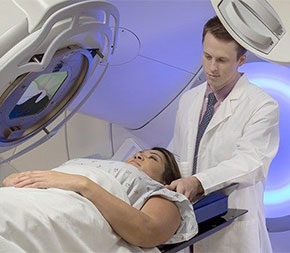 therapist readying patient for a scan
