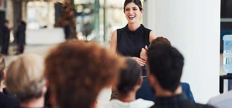 female manager speaking to group of healthcare students
