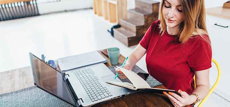 woman taking online degree program at laptop