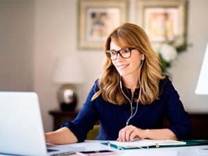 professional at home office works on laptop
