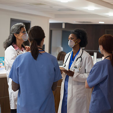 medical professionals talking in medical lobby