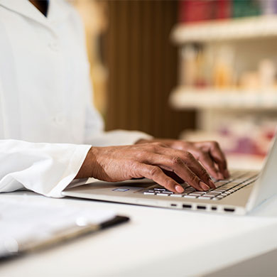 hands typing on computer keyboard