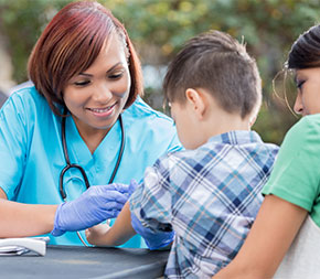 healthcare professional working with young patient outdoors