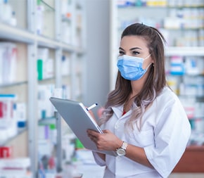 pharmacy technician checking medicine inventory