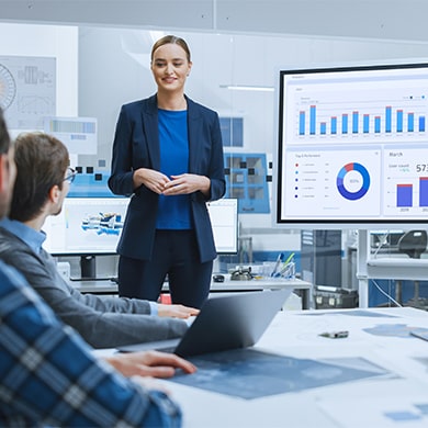 professional giving presentation at conference table in lab