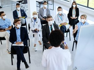 healthcare and business professionals attend training class