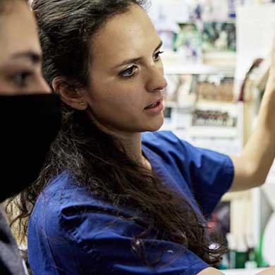 xray tech looks over scans with nurse