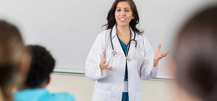 medical instructor teaching class of students