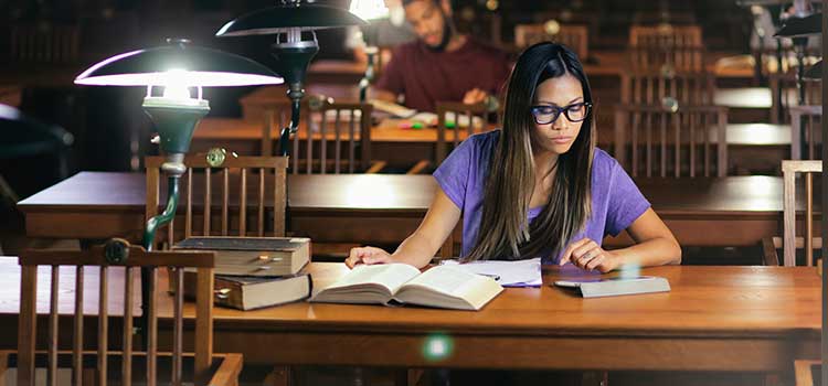 female student studying in library