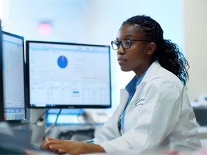 healthcare administrator looks at data files