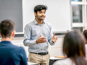 healthcare administration student presents capstone project to class