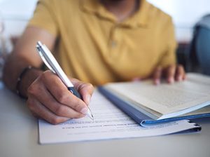 a medical coder takes a certification exam