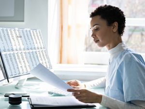 medical coder uses a software program to calculate billing costs