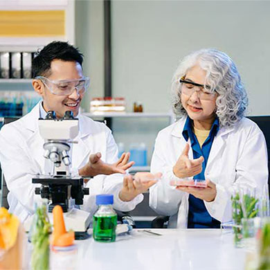 a pair of research dietitians work in a lab and test food samples