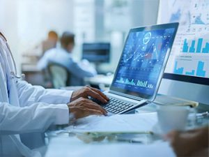 medical biller sourcing data analytics on laptop