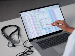 laptop screen with medical coding being audited