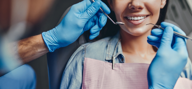 close up of a dental hygienist about to examine someone's mouth